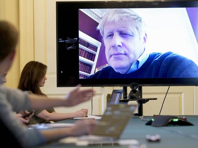 Prime Minister Boris Johnson chairs Britain’s COVID-19 meeting remotely after testing positive for the coronavirus. Picture: AP