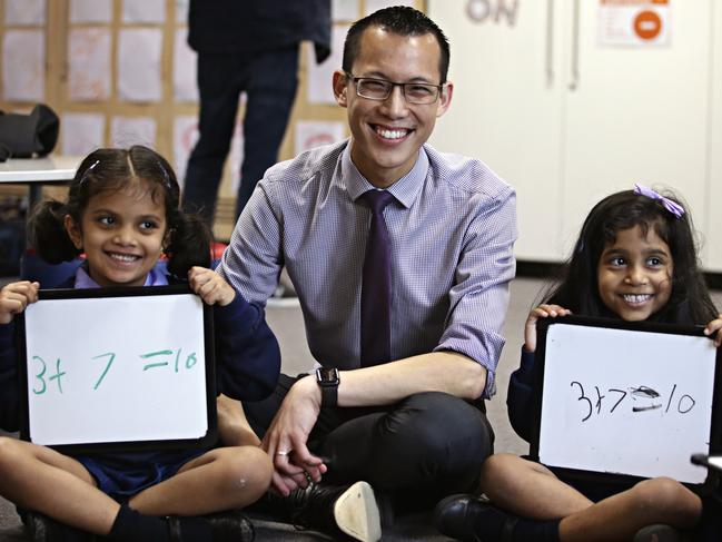 Maths teacher Eddie Woo with Parramatta Public School students Hawwa Faslu Rahman and Dhwani Raghesh earlier this year. Picture: Adam Yip