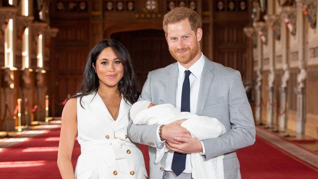 Prince Harry, Duke of Sussex and Meghan, Duchess of Sussex, pose with their newborn son Archie Harrison Mountbatten-Windsor during a photocall in St George's Hall at Windsor Castle on May 8, 2019. Picture: Dominic Lipinski/Getty