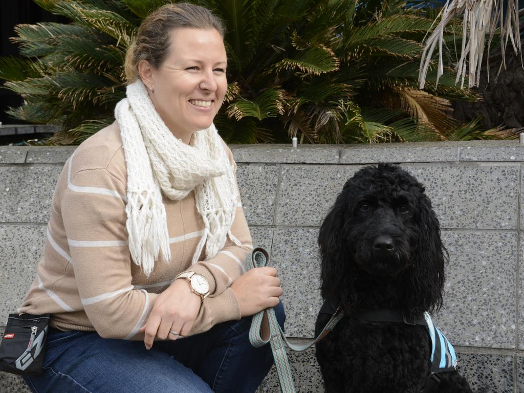 Vanessa Curtis has been training three-year-old labradoodle Hope to be a therapy dog at Toowoomba court, and has been volunteering to help calm young people appearing at Toowoomba Children's Court.