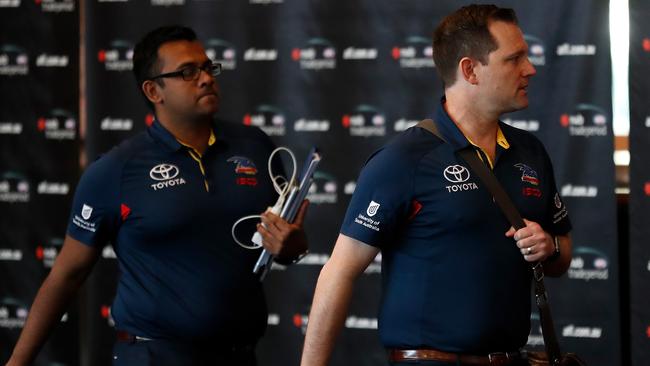 Crows list manager Justin Reid, right, arrives for trade week on Monday. Picture: Michael Willson/AFL Media/Getty Images