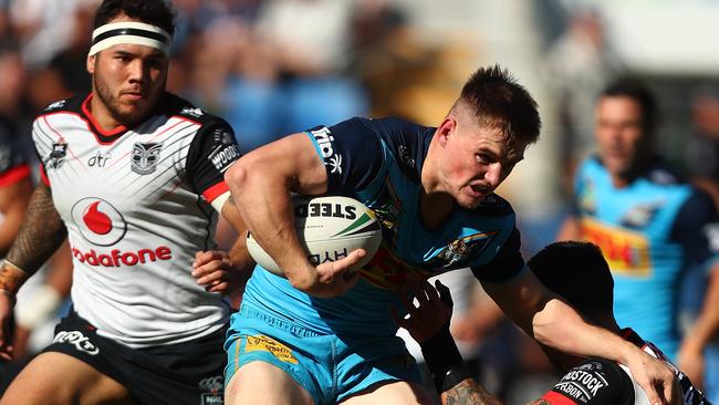 Titans playmaker AJ Brimson takes on the Warriors defence. Picture: Getty Images