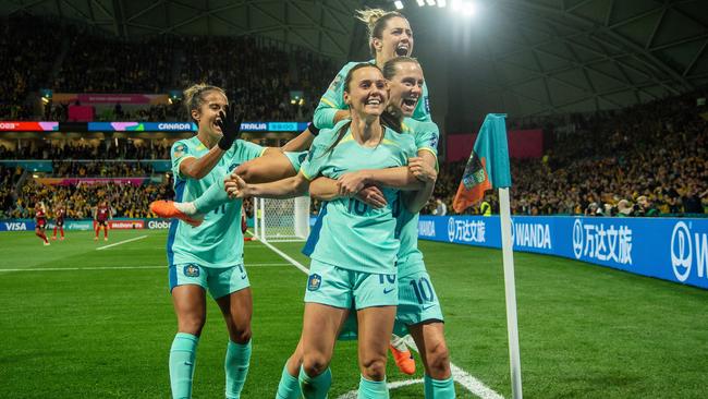 Hayley Raso celebrates her second goal with Emily Van Egmond, Katrina Gorry, rear, and Mary Fowler, left, in the Matildas’ win on Monday night. Picture: Getty Images