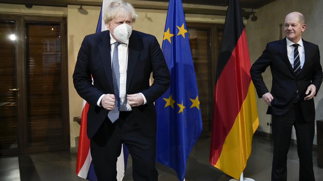 German Chancellor Olaf Scholz, right, and Britain's Prime Minister Boris Johnson during the 2022 Munich Security Conference. Picture: Matt Dunham / Getty Images