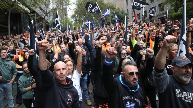 Protesters waving flags in support of the union. Picture: David Crosling