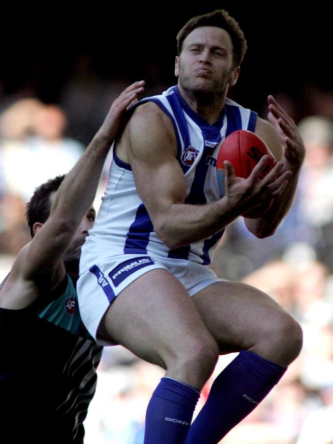 Sav Rocca takes a mark in front of Port Adelaide’s Darryl Wakelin in the 2005 elimination final.