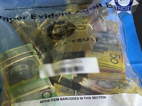 Officers uncovered a large amount of cash. Picture: AFP