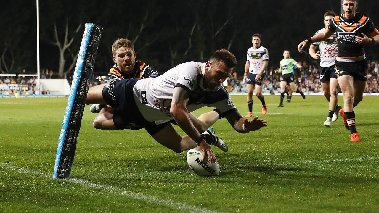 Cowboys winger Kyle Feldt dives over to score a try that was disallowed.