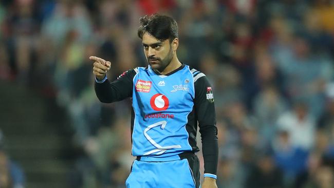 GEELONG, AUSTRALIA – JANUARY 03: Rashid Khan of the Strikers is congratulated by his teammates after dismissing Cameron White of the Renegades during the Big Bash League match between the Melbourne Renegades and the Adelaide Strikers at GMHBA Stadium on January 03, 2019 in Geelong, Australia. (Photo by Scott Barbour/Getty Images)