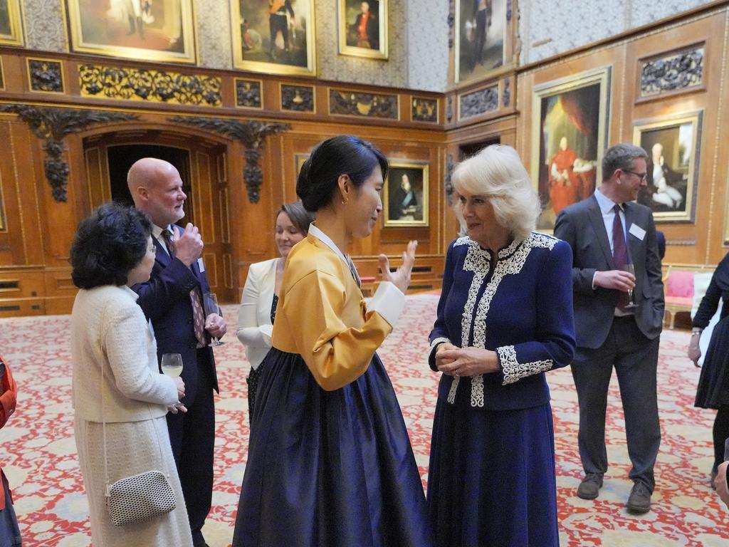 Queen Camilla speaks to Haein Song during a reception at Windsor Castle for authors, illustrators and binders. Picture: Getty Images