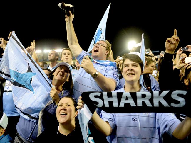 Fans cheer on their heroes during wild celebrations overnight. Picture: Jeremy Piper