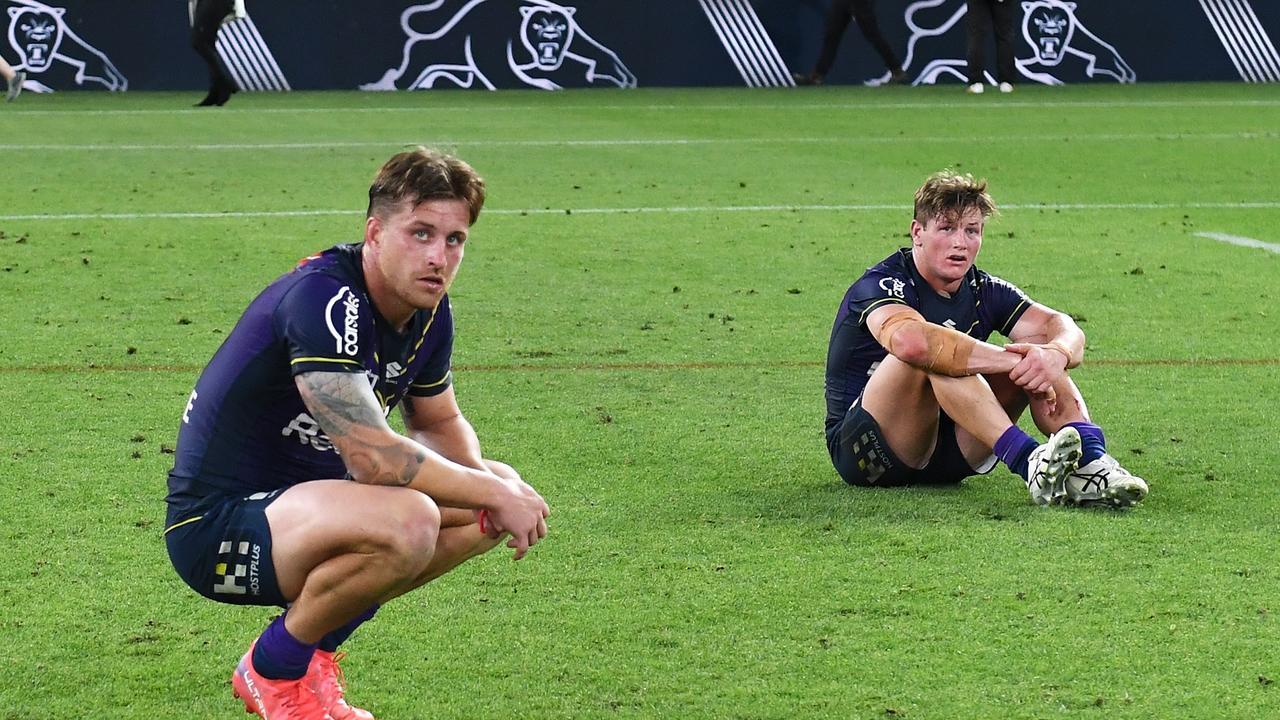 BRISBANE, AUSTRALIA - SEPTEMBER 25: Cameron Munster and Harry Grant of the Storm looks dejected after defeat during the NRL Preliminary Final match between the Melbourne Storm and the Penrith Panthers at Suncorp Stadium on September 25, 2021 in Brisbane, Australia. (Photo by Bradley Kanaris/Getty Images)