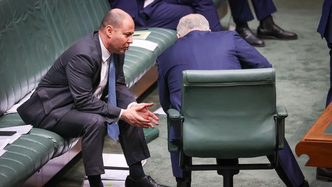 Prime Minister Scott Morrison (R) talks with Treasurer Josh Frydenberg during Question Time in the House of Representative. Picture: Getty