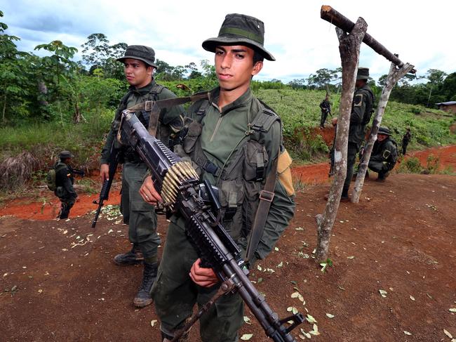 Colombia Police National Narcotics personnel in Tumaco (south west Colombia) during an irradication cocaine plantation operation. Picture Gary Ramage