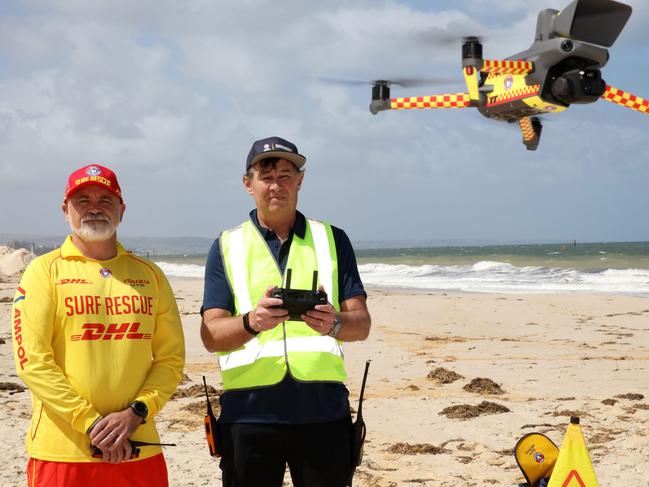 ADELAIDE, SOUTH AUSTRALIA - Advertiser Photos NOVEMBER 8, 2024: SA Surf Lifesaving and emergency operations manager Sean Faulkner with volunteer Surf lifesaving  drone pilot Chris Schrapel at West Beach, SA. Picture Emma Brasier