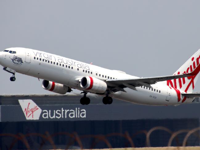 Virgin Australia plane departing from Brisbane Airport Pictures David Clark Photography