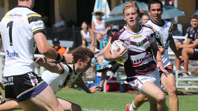 The Harvey Norman rugby league - Jye Watton as Bailey Trew approaches. Pic Mike Batterham