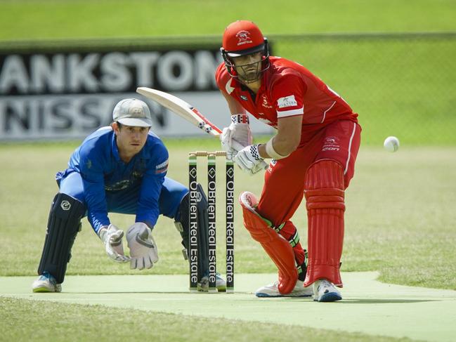 Langwarrin keeper Tom Hussey looks on as Sorrento’s Jake Wood plays a drive. Picture: Valeriu Campan