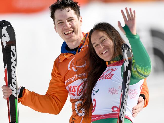 Supplied image of Australian B2 Paralympic skier Melissa Perrine (right) and with guide Christian Gieger, celebrating after winning the bronze medal during the Women's Super Combined Slalom, Visually Impaired during day four of the PyeongChang 2018 Paralympic Games in PyeongChang, South Korea, Tuesday, March 13, 2018. (AAP Image/Australian Paralympic Committee, Sport The Library, Jeff Crow) NO ARCHIVING, EDITORIAL USE ONLY