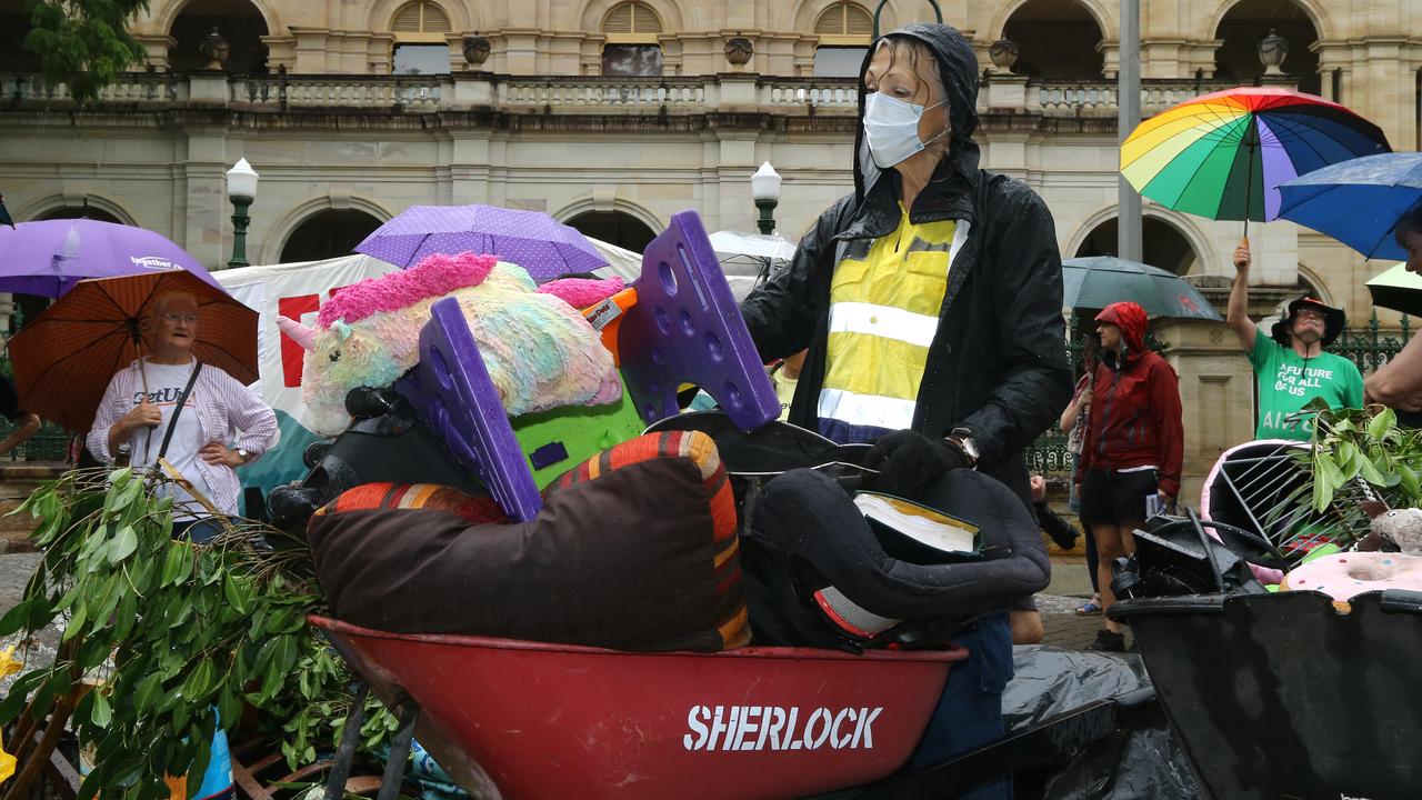 Diane Tucker from Seven Hills with her flood-damaged belongings. Picture: David Clark