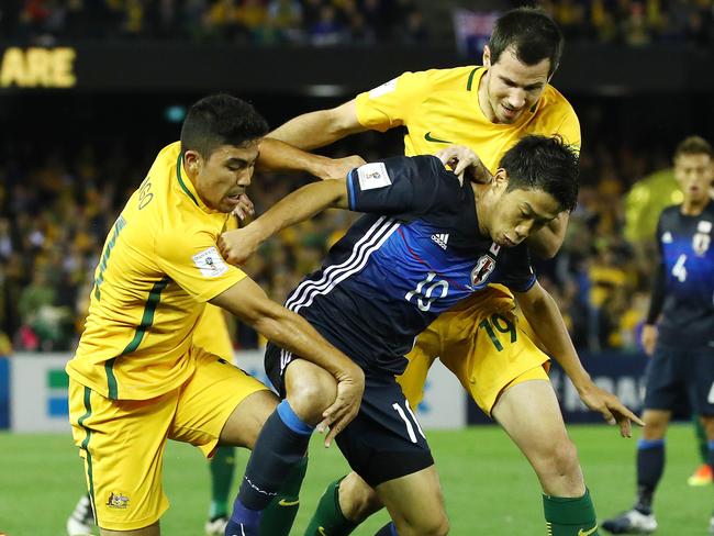 World Cup Qualifier,  Australia V's Japan at Etihad Stadium, Docklands, Melbourne Australia, 11th October  2016.   Australia's Massimo Luongo and Ryan McGowan try to stop Shinji Kagawa of Japan Picture : George Salpigtidis