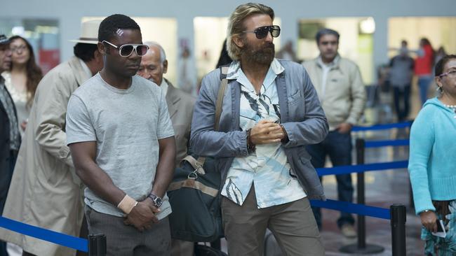 David Oyelowo (left) and Sharlto Copley in a scene from film Gringo.
