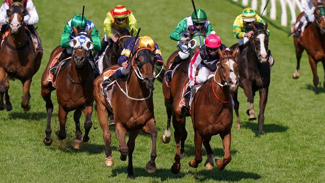 Wild Planet (gold cap) makes his run to win the Moonga Stake. Picture: Getty Images