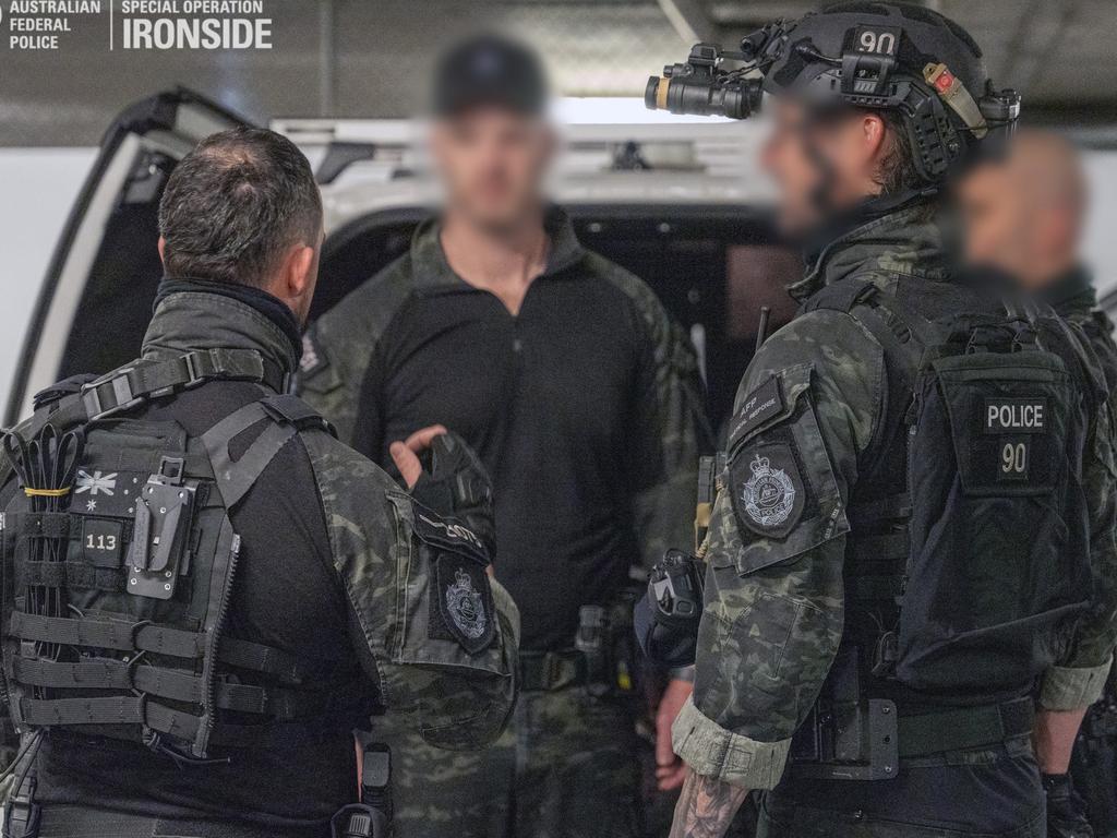 Heavily-armed AFP officers about to conduct a search as part of Operation Ironside. Picture: AFP