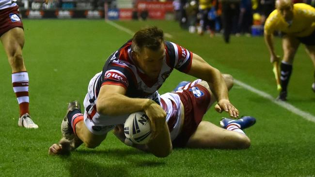 Brett Morris bagged a hat-trick in the first half of his Sydney Roosters debut to stun Wigan. Picture: Getty