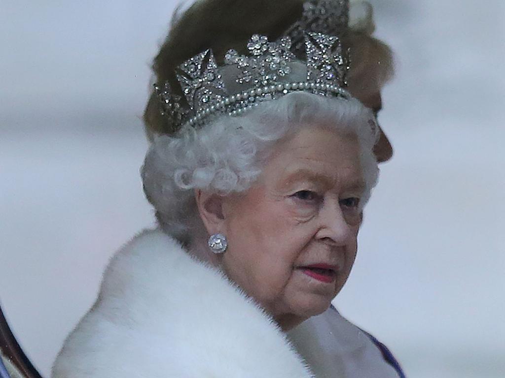 Britain's Queen Elizabeth II rides in the Diamond Jubilee State Coach towards parliament. Picture: ISABEL INFANTES / AFP.