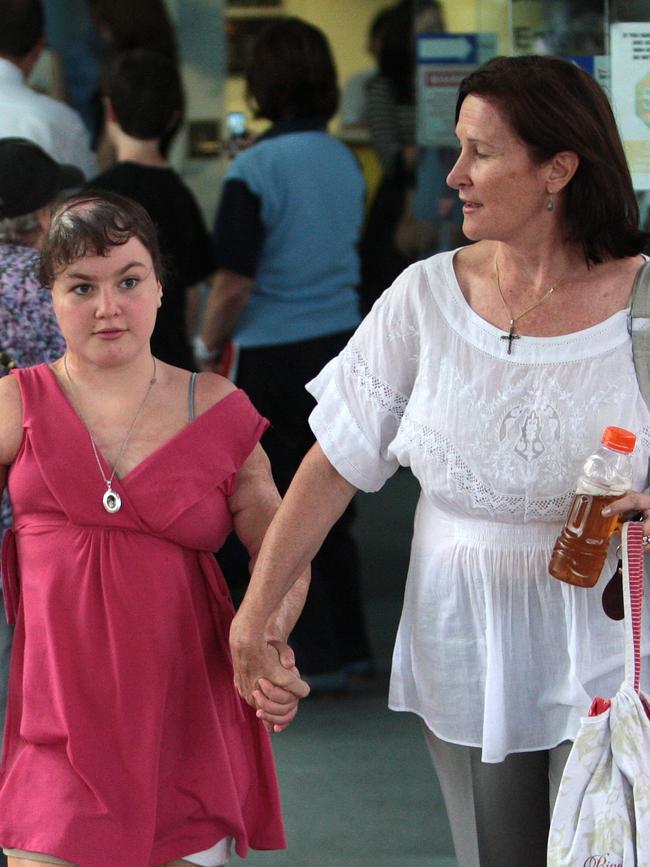 ophie with her mum Caroline walk out of the Sydney Children's hospital after visiting sick kids.