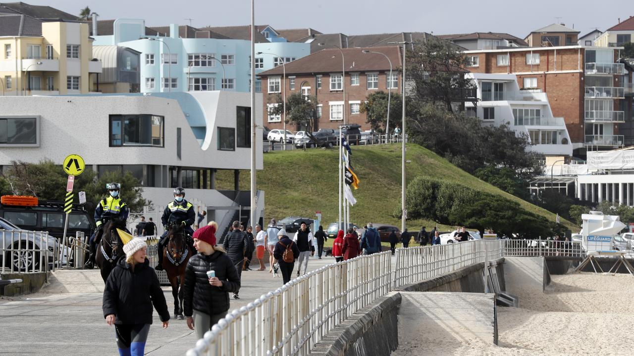 Mounted Police patrolling as a small number of people exercising at Bondi Beach as Sydney is in lockdown after the Bondi outbreak. Picture: Jonathan Ng