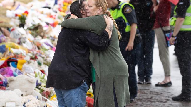 Mourners pay tribute to the children who died after gust of wind swept away a jumping castle at Hillcrest Primary School in Devonport Tasmania. Picture: Jason Edwards