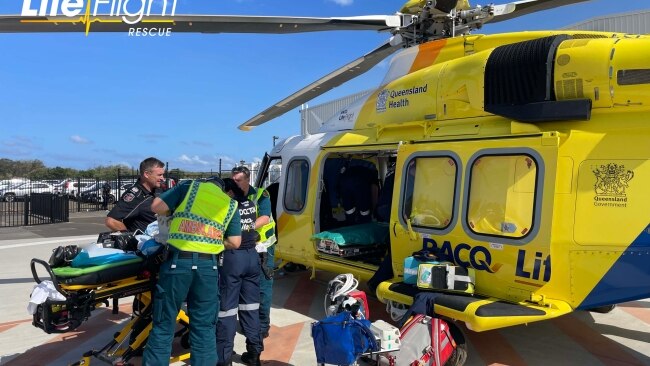 Three passengers, a woman and two young children believed to be boys, were flown to nearby Gold Coast hospitals in a critical condition. Picture: RACQ LifeFlight