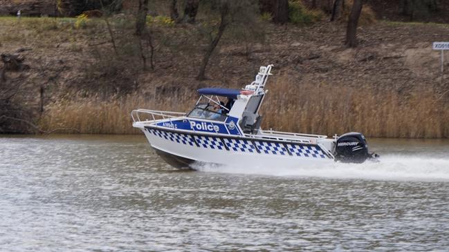 New South Wales police search for a missing swimmer in the Murray River near Mildura on Saturday. Picture: Michael DiFabrizio