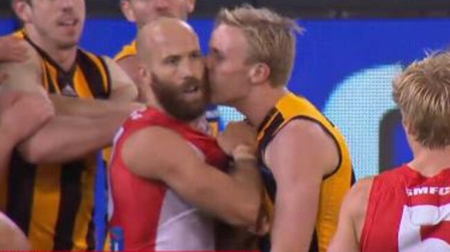 Will Langford plants a kiss on Jarrad McVeigh.