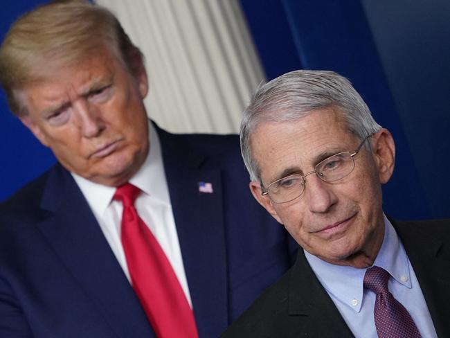 (FILES) In this file photo taken on April 22, 2020, Director of the National Institute of Allergy and Infectious Diseases Anthony Fauci, flanked by US President Donald Trump, speaks during the daily briefing on the novel coronavirus at the White House in Washington, DC. President Donald Trump said on January 24, 2025, that he has revoked security protection for Fauci, his former Covid advisor who has received death threats over his handling of the pandemic. "You can't have a security detail for the rest of your life because you worked for government," Trump told reporters in North Carolina, where he was on a visit to inspect flood damage. (Photo by MANDEL NGAN / AFP)