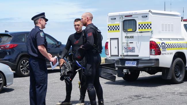 Police divers with Limestone Coast Police operations manager Campbell Hill after searching for a Victorian man missing off the coast near Port MacDonnell. Picture: Jessica Ball