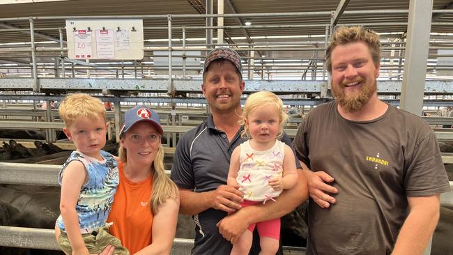 Colleen and Jake Follett, Poowong, with their children Max, 4 and Grace, 1, and Jake's brother Zack Follett, bought 147 Angus breeding females, both joined females and heifers, at the Wodonga feature female sale.