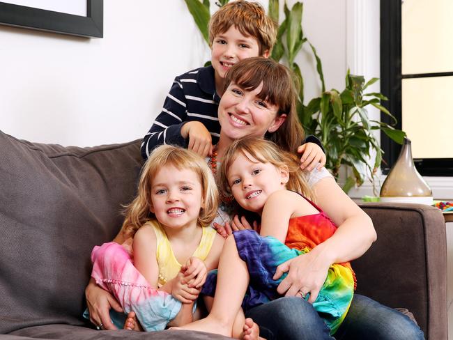 Anna Kratovil, pictured with her children Finn, 9, and twin girls Isabel and Zoe, aged 3, still deals with grief after she miscarried her baby boy. Picture: Tim Hunter