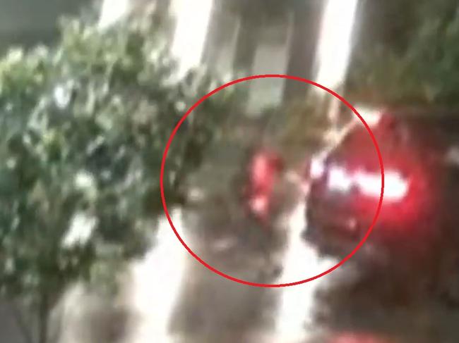 CCTV has captured the alleged moment gunmen opened fire on a house in Marsden Park, showing two men exiting and entering a black SUV. Picture: Supplied / Channel 9