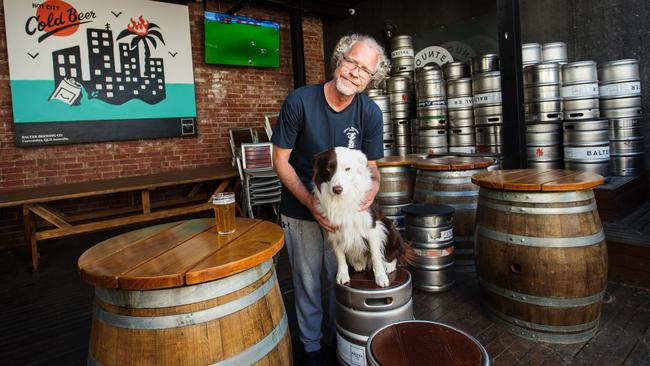 Alistair Carragher, with his dog Bozo, wants to open the doors to his Great Northern Hotel in Carlton North for next Saturday’s AFL grand final. Picture: Paul Jeffers