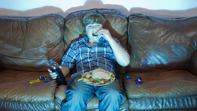 Banning junk food adverts on television until late at night could reduce childhood obesity and save almost $800 million. Generic picture: iStock