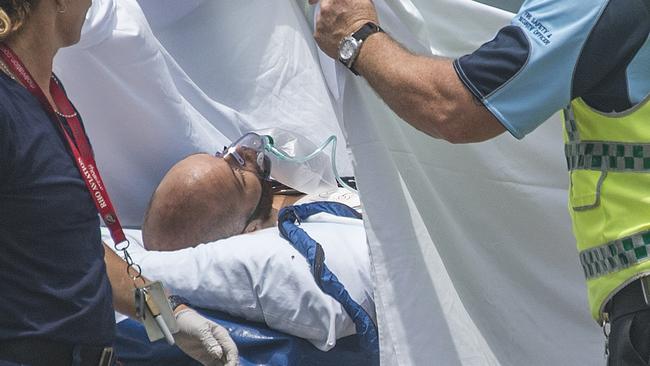 The shark victim arrives at Cairns to be transferred to Cairns Hospital. Picture: Brian Cassey