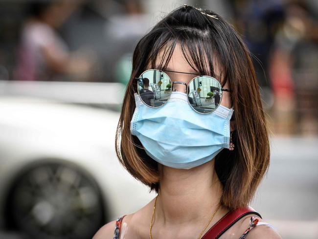 A woman wearing a face mask to protect against coronavirus in Bangkok. Picture: Mladen Antonov/AFP