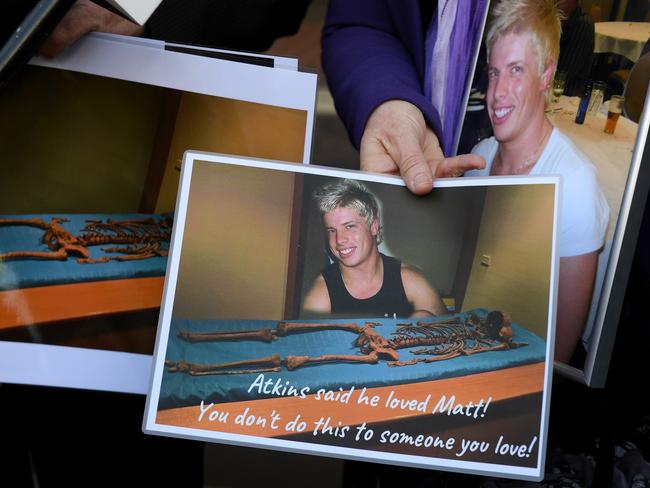 Mark and Faye Leveson hold photographs of their son Matthew's skeletal remains at the inquest. Picture: Dan Himbrechts