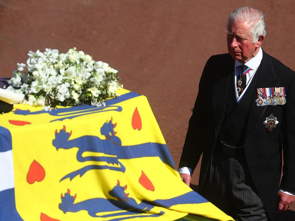 Prince Charles walks alongside his father’s coffin. Picture: AFP