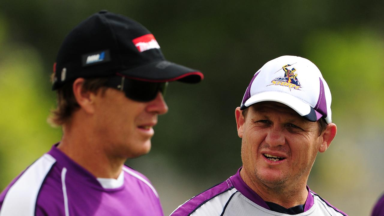 Kevin Walters talks with coach Craig Bellamy during their time together at the Storm