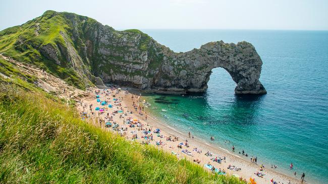 Durdle Door is a natural limestone arch on England's Jurassic Coast.