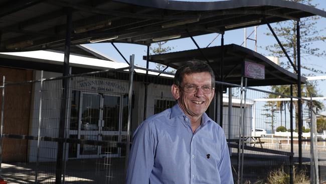 Councillor Peter Cumming in front of the site for the proposed micro brewery on the Wynnum foreshore. Picture: AAP Image/Regi Varghese